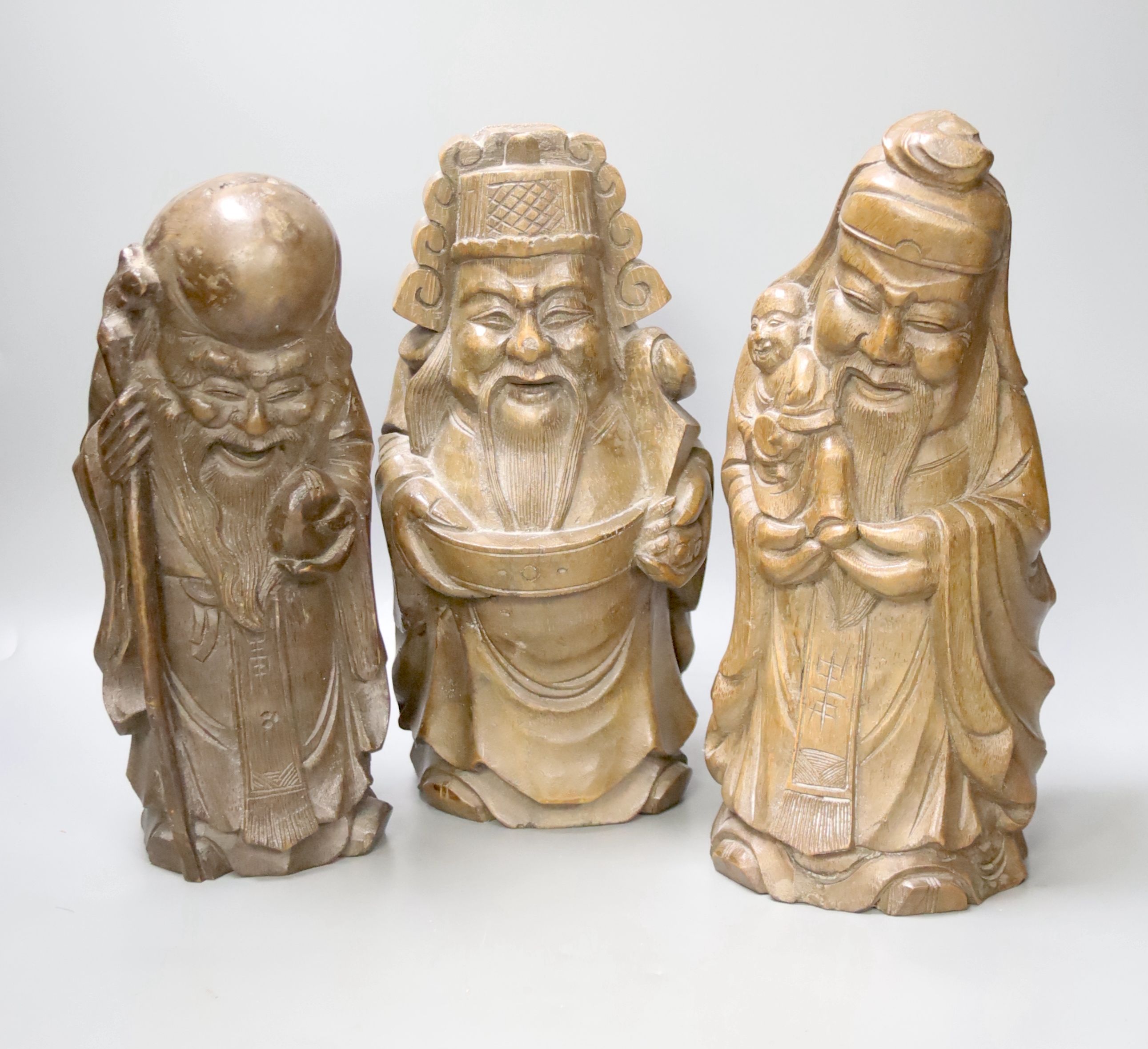 Three Chinese carved bamboo figures of the three star gods